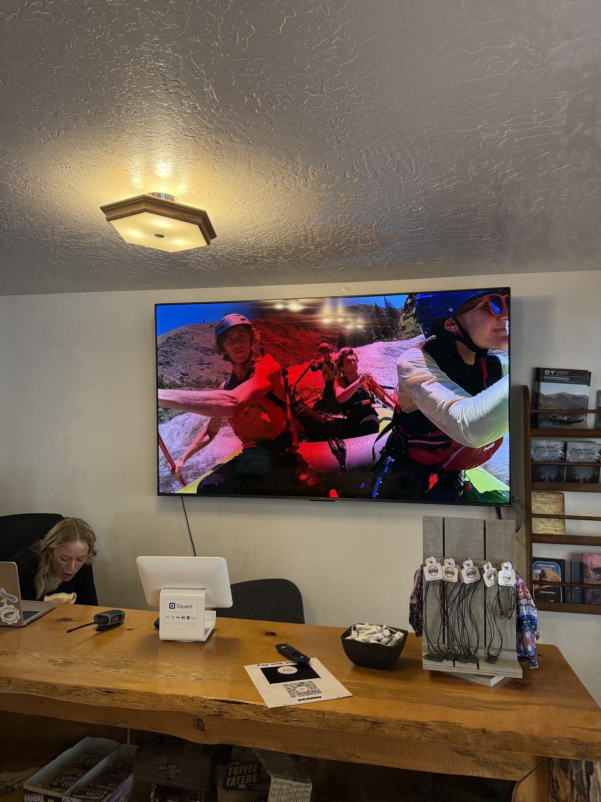 A tribute photo of Scott on screen at the outfitter