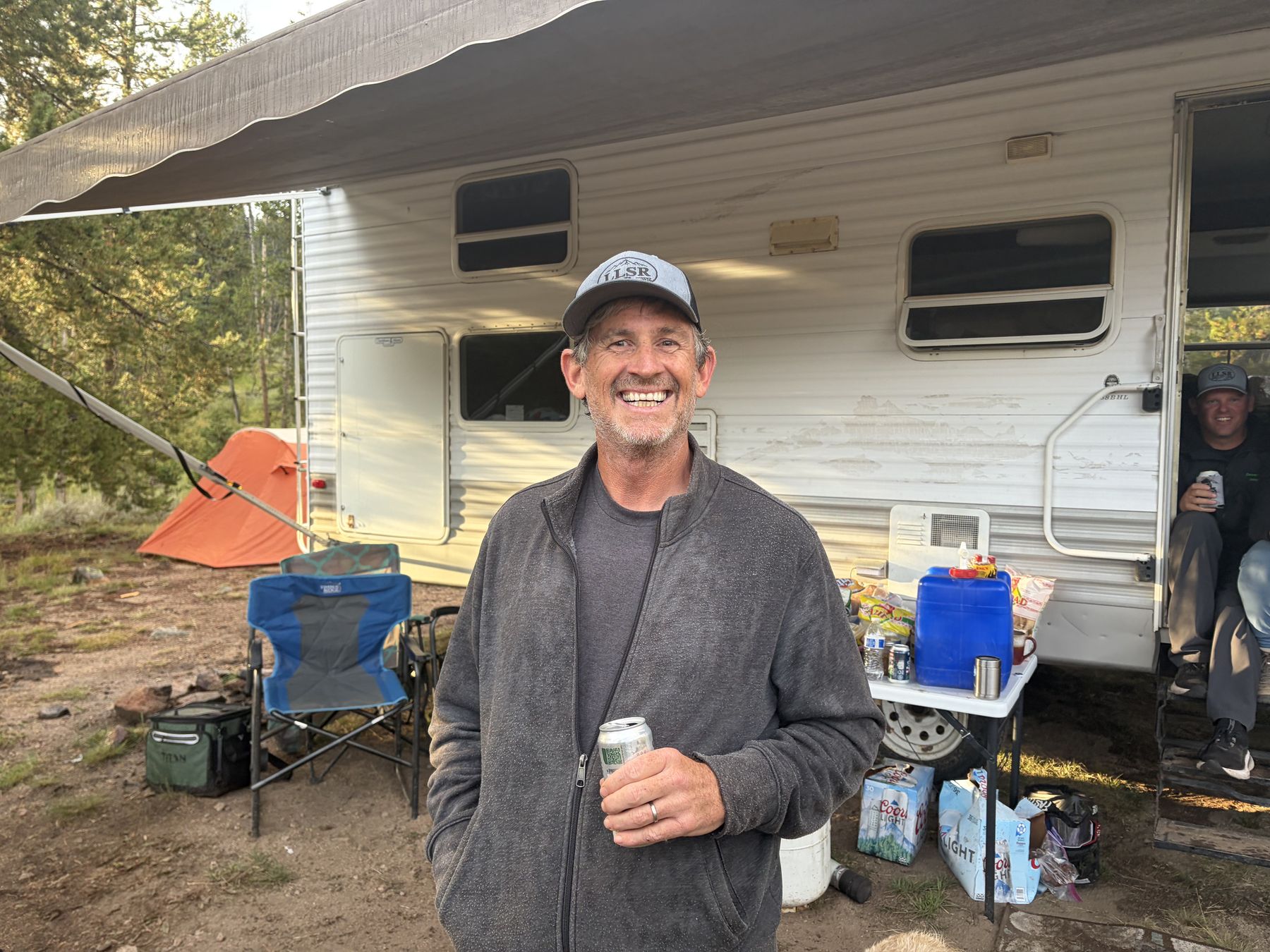 Camp under the awning, a cold one and a grin